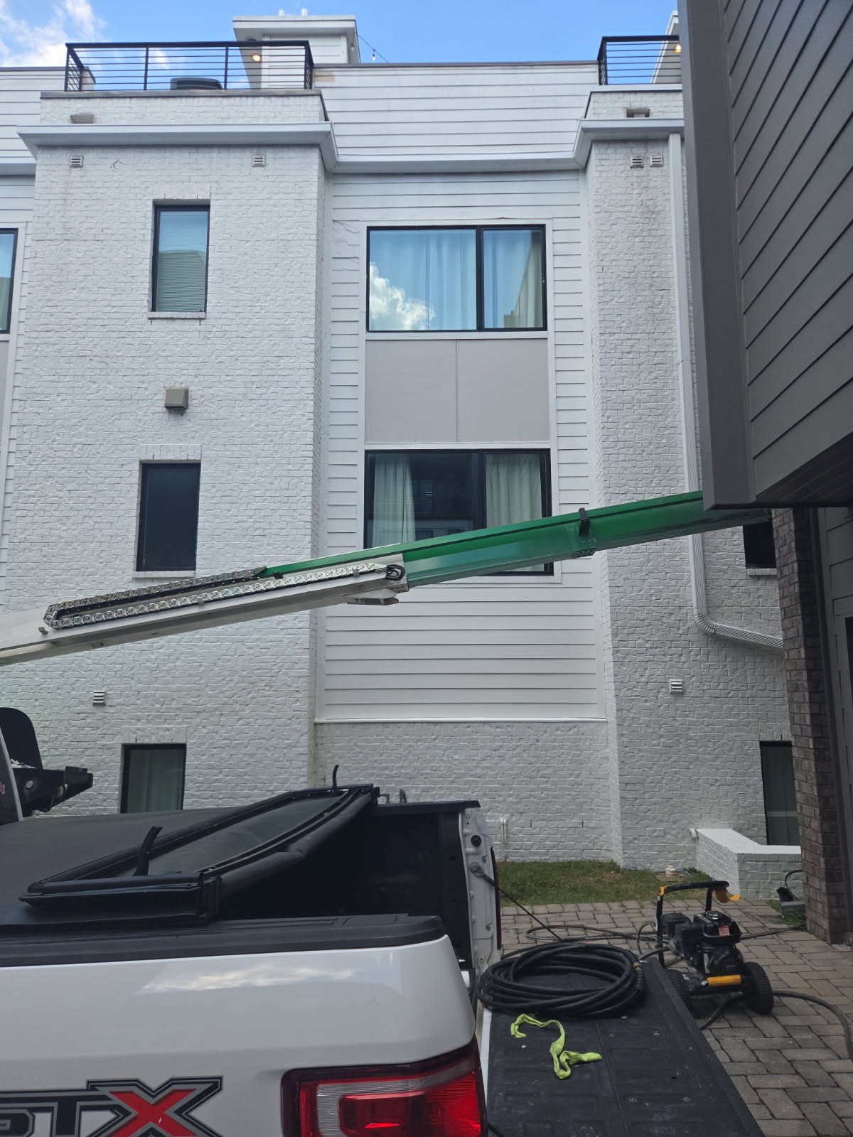 Equipment staged at townhouse exterior