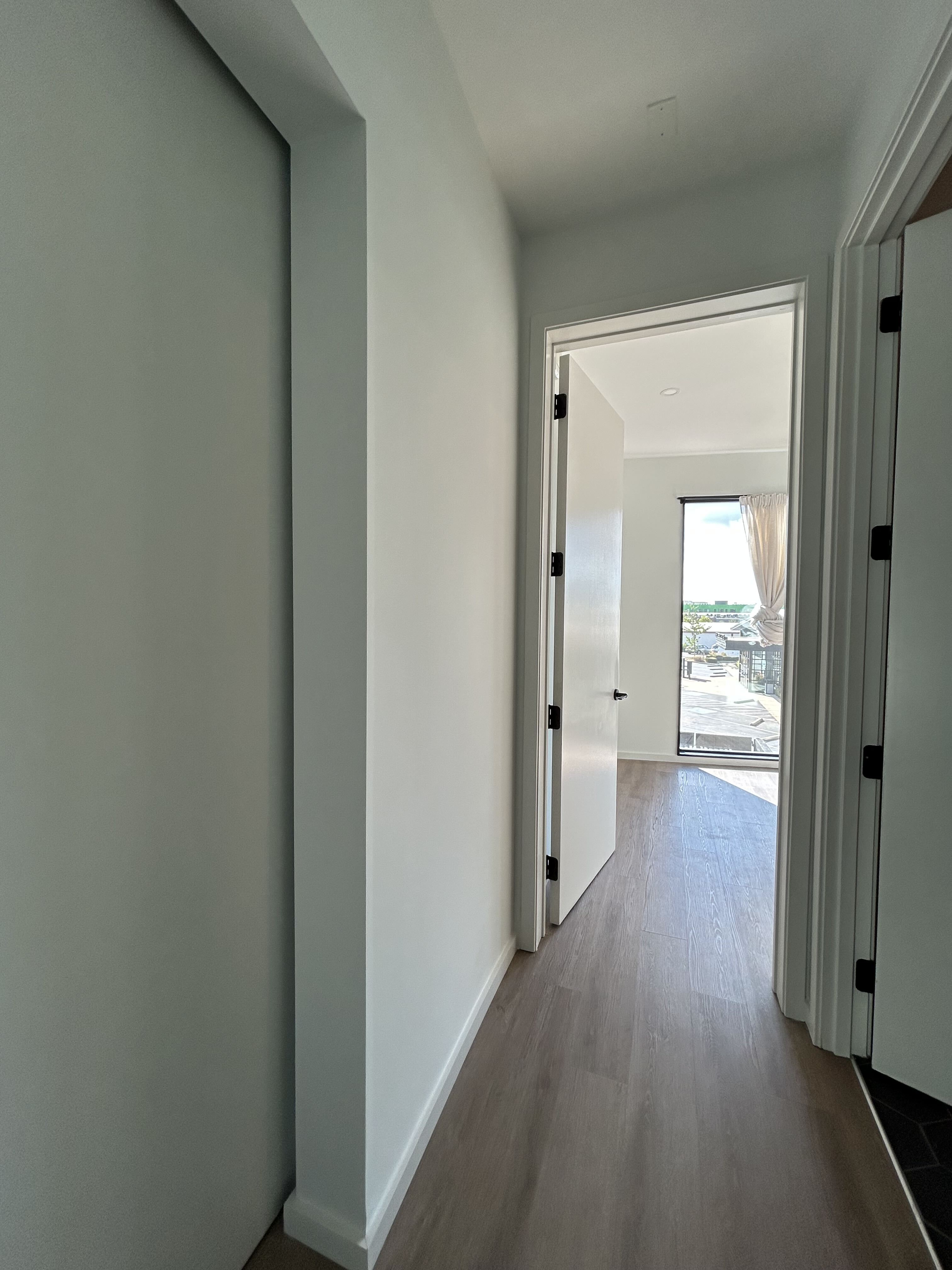 Freshly painted hallway with white trim and neutral walls in a 2024 Nashville condo