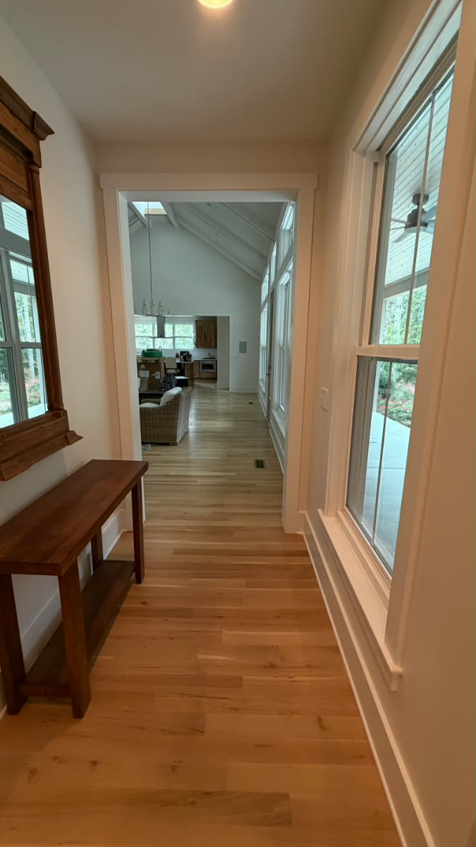 Bright hallway with fresh white trim and new wall paint